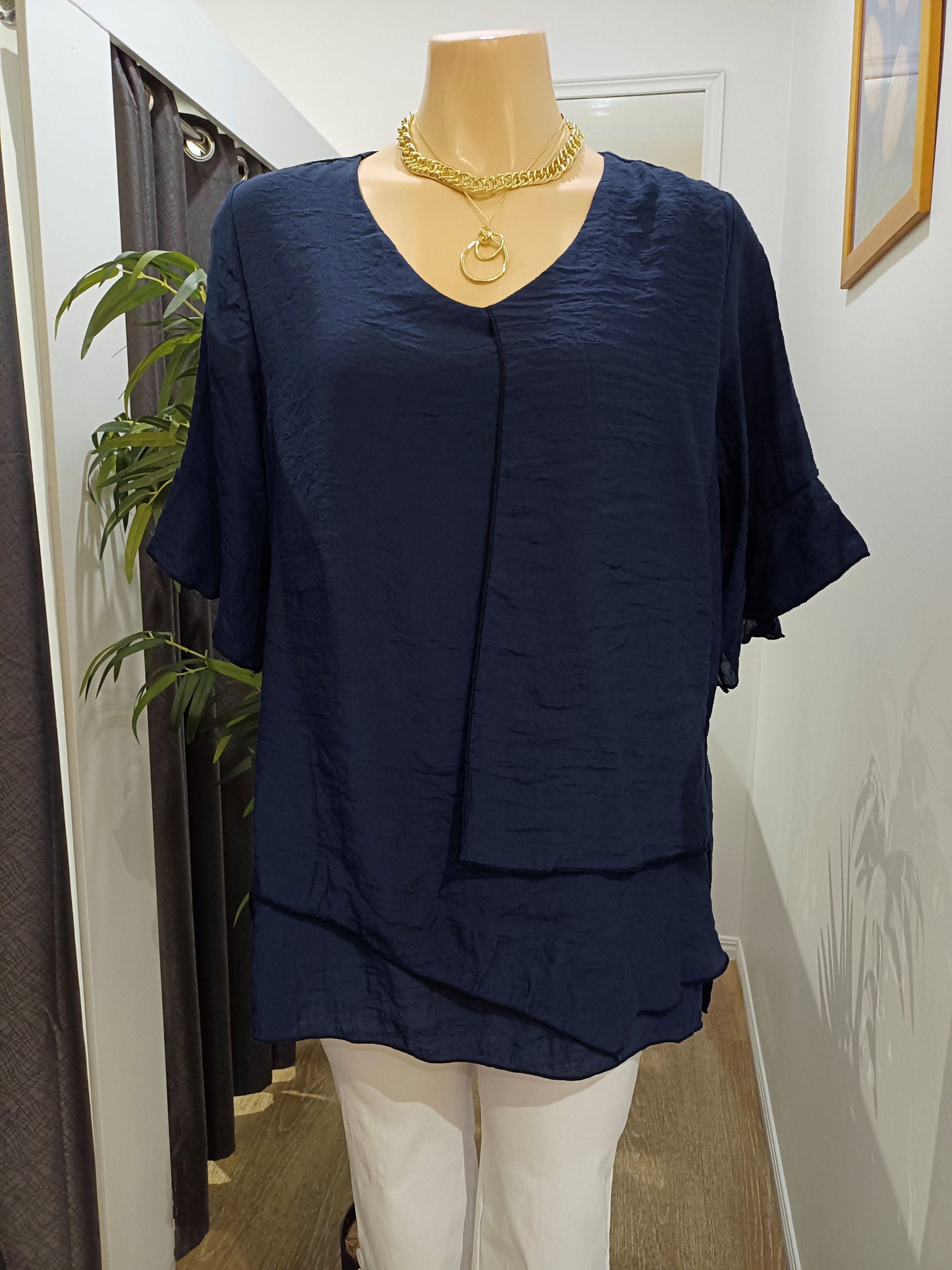 Navy blue Split Top on a mannequin with in the Boo Boo's Store